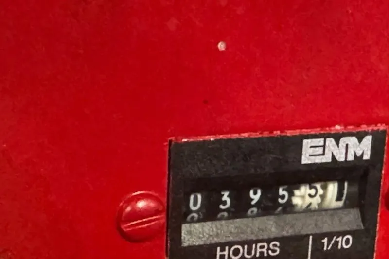 Slide: The Image of Hour meter reading 395.5 on a red Sea Ray 380 Sundancer, 2001 model. - 63