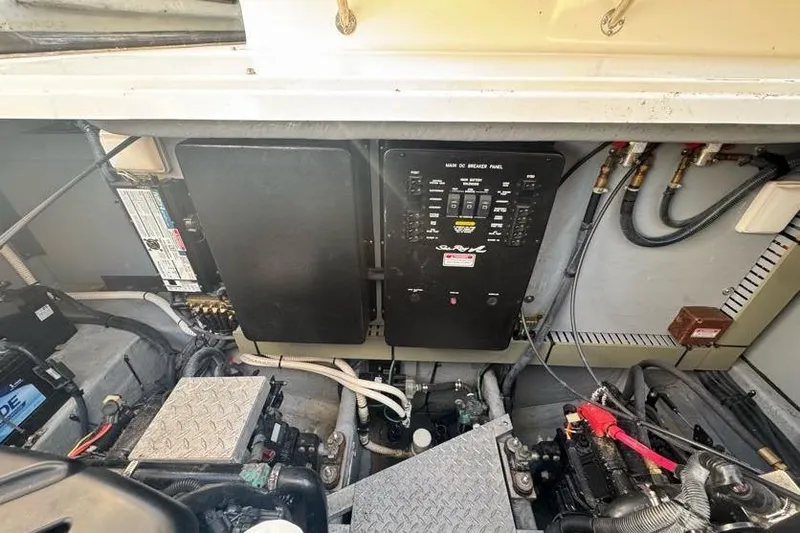 Slide: The Image of Engine compartment of a 2001 Sea Ray 380 Sundancer with electrical panel and components. - 64
