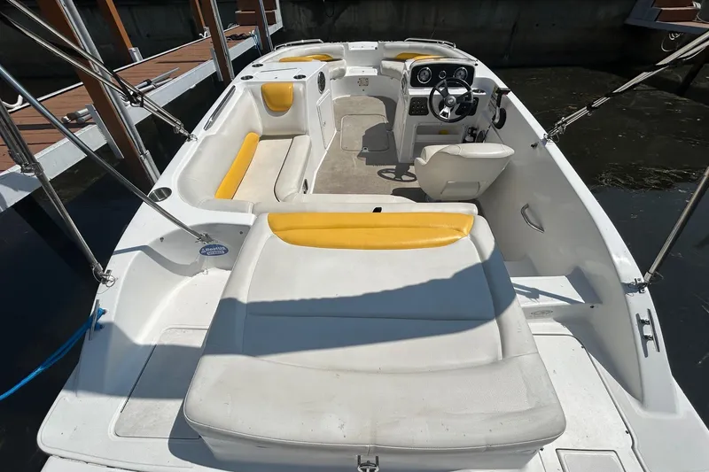Slide: The Image of 2014 Hurricane SunDeck Sport 188 IO boat interior with yellow and white seating. - 4