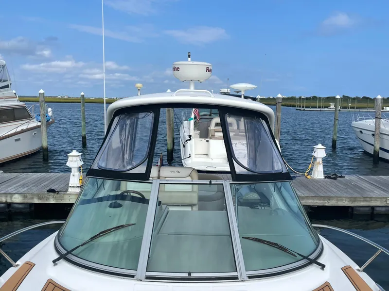 Slide: The Image of Sea Ray 330 Sundancer 2012 docked at marina under clear blue sky. - 12