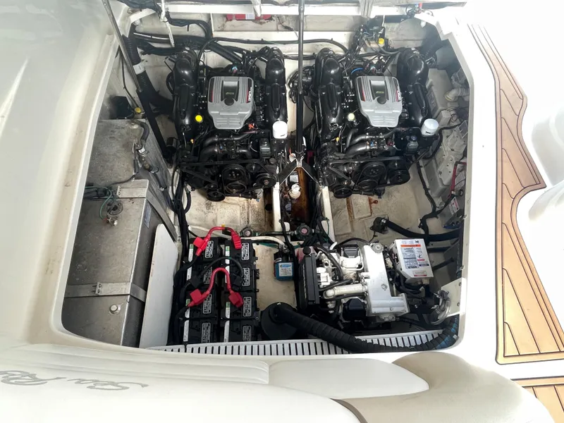 Slide: The Image of Engine compartment of 2012 Sea Ray 330 Sundancer with dual engines and battery setup. - 25