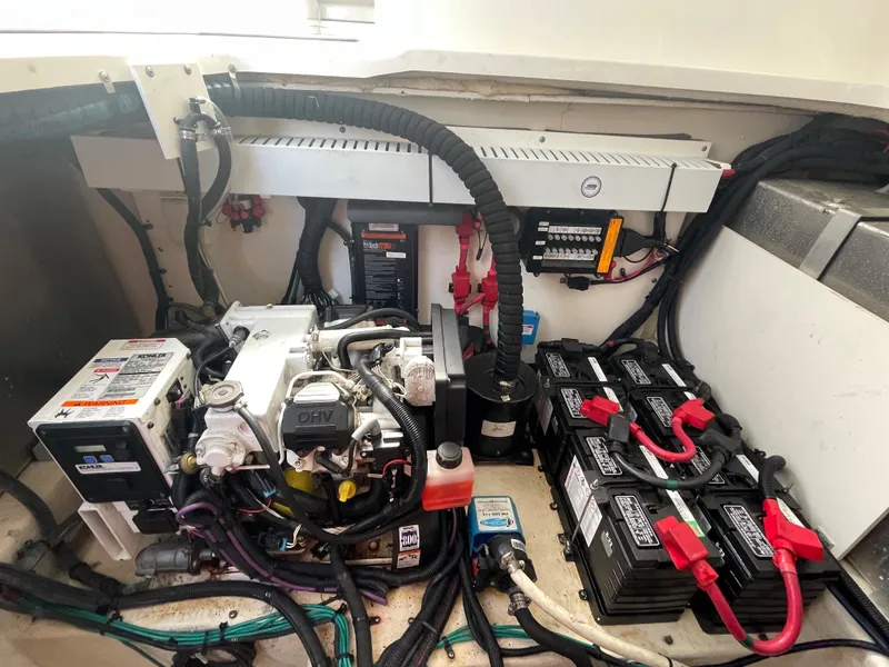 Slide: The Image of Engine compartment of 2012 Sea Ray 330 Sundancer with batteries and wiring. - 26