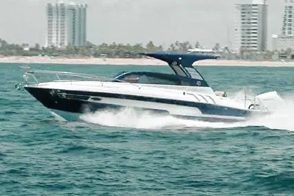 Slide: The Image of 2024 Hanover 305 White & Blue Edition yacht cruising on ocean near city skyline. - 4