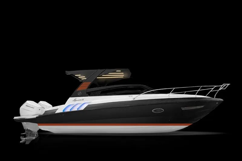 Slide: The Image of 2025 Hanover 305 Black & Orange Edition boat, sleek design, side view on black background. - 5