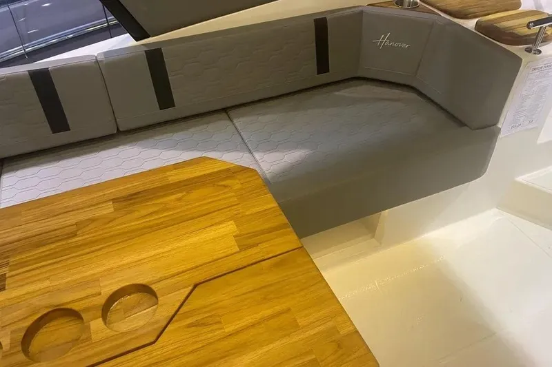 Slide: The Image of Luxurious seating and wooden table in 2026 Hanover 387 Tuxedo Luxury Edition boat interior. - 3