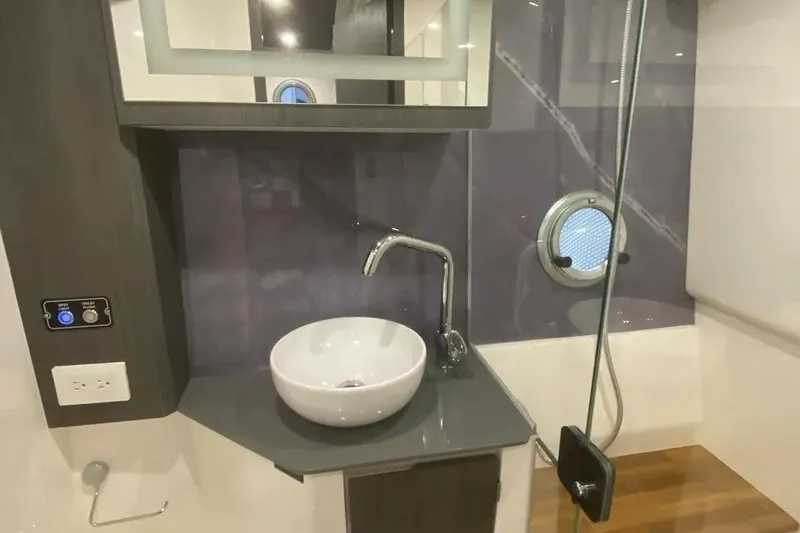 Slide: The Image of Luxurious bathroom interior of 2026 Hanover 387 Tuxedo Luxury Edition with modern sink and fixtures. - 6