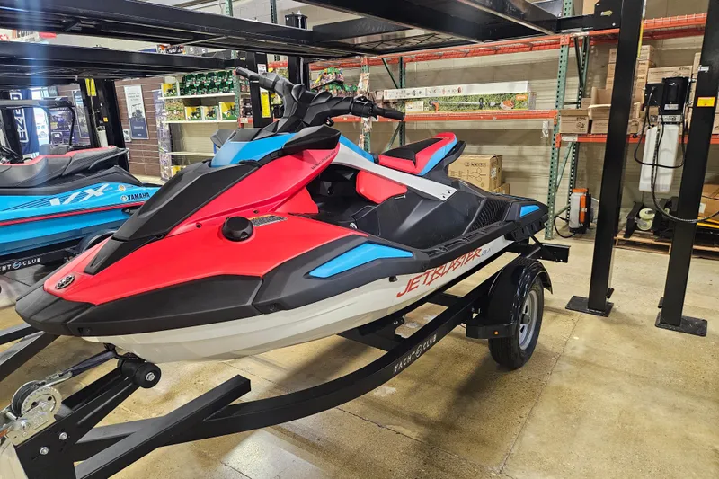 Slide: The Image of 2025 Yamaha WaveRunner Jet Blaster DLX 3 Pass on display in a showroom. - 0