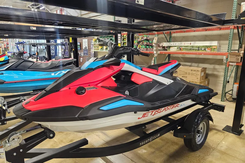 Slide: The Image of 2025 Yamaha WaveRunner Jet Blaster DLX 3 Pass on display in a showroom. - 7