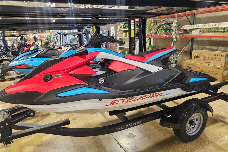 Slide: The Image of 2025 Yamaha WaveRunner Jet Blaster DLX 3 Pass on display in a showroom. - 8