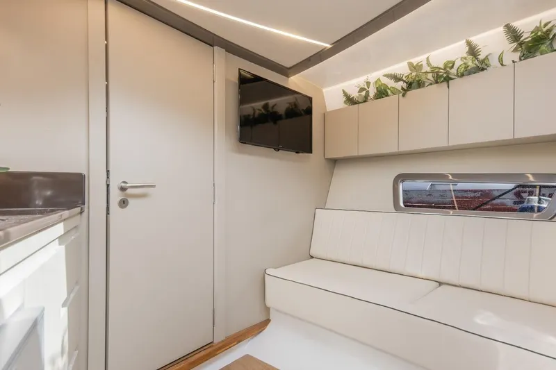 Slide: The Image of Modern interior of 2024 Hanover 415 Pure Gray yacht with sleek design and greenery accents. - 13