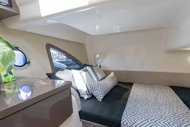 Slide: The Image of Luxurious interior cabin of 2024 Hanover 415 Pure Gray yacht, featuring modern bedding and decor. - 15