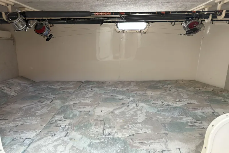 Slide: The Image of Interior cabin of 1994 Grady-White Marlin 280 with fishing rods stored overhead. - 8
