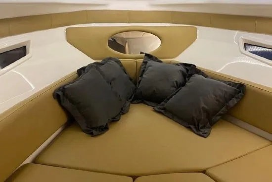 Slide: The Image of Luxurious interior of 2024 Hanover 305 White & Gray Edition boat with plush seating and cushions. - 10