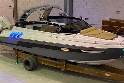 Slide: The Image of 2024 Hanover 305 White & Gray Edition boat in a warehouse setting. - 4