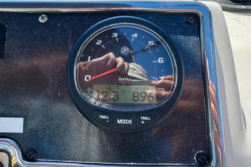 Slide: The Image of Close-up of a 2021 Scout 210 Dorado boat tachometer displaying RPM, volts, and hours. - 17