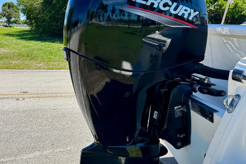 Slide: The Image of Mercury outboard motor on 2021 Scout 210 Dorado boat, parked on a sunny day. - 24