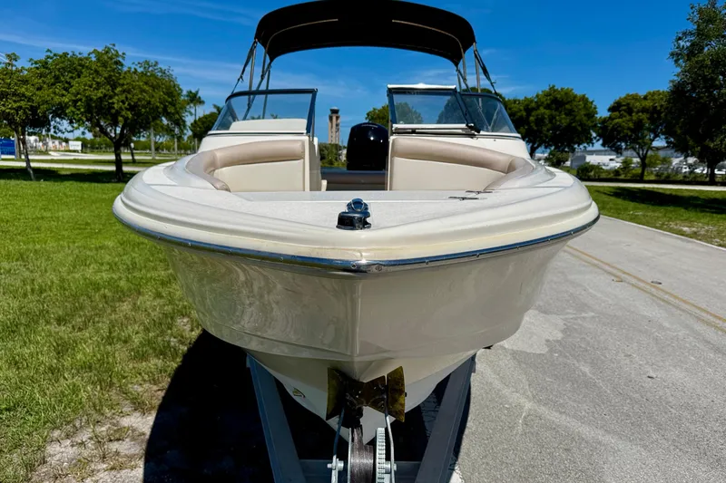 Slide: The Image of 2021 Scout 210 Dorado boat on trailer, parked outdoors on a sunny day. - 3