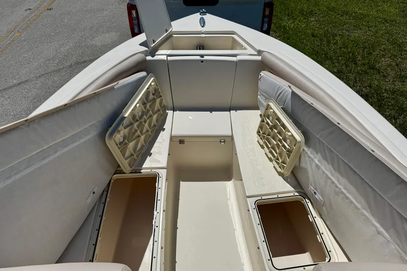 Slide: The Image of 2021 Scout 210 Dorado boat interior with open storage compartments. - 9