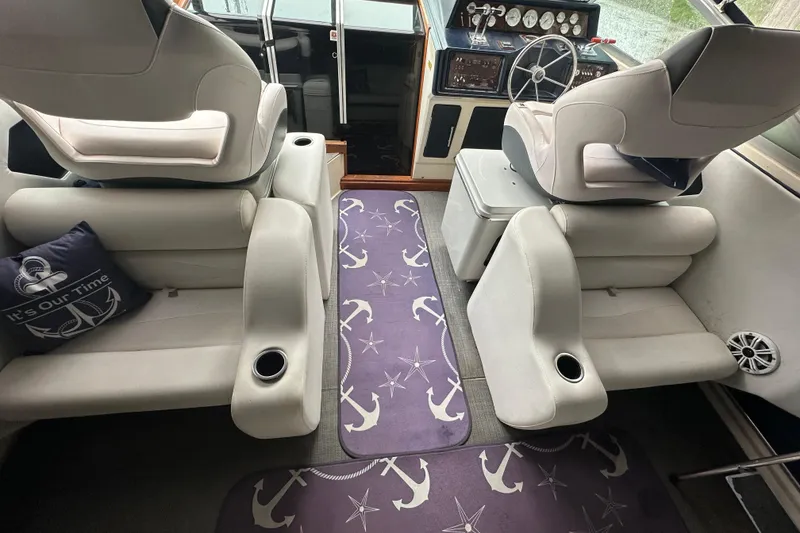 Slide: The Image of 1986 Sea Ray 340 Express Cruiser docked, displaying "It's Our Time" and an American flag. - 9