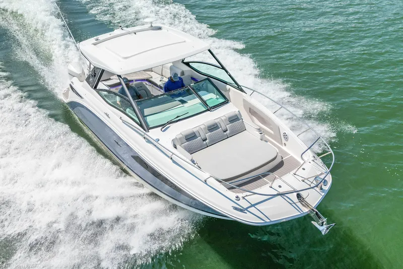 Slide: The Image of 2022 Sea Ray Sundancer 320 Outboard cruising on open water, aerial view. - 11