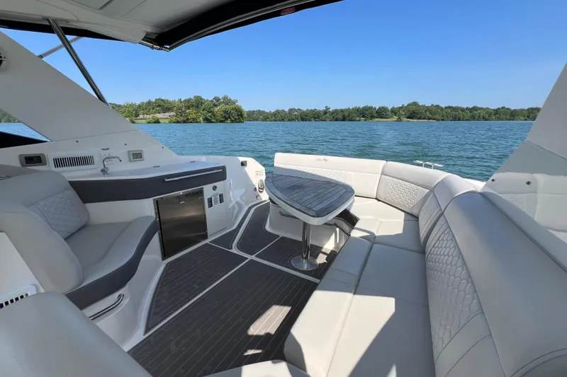 Slide: The Image of Luxurious 2022 Sea Ray Sundancer 320 Outboard interior with plush seating and scenic water view. - 26