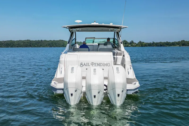 Slide: The Image of 2022 Sea Ray Sundancer 320 Outboard cruising on a serene lake. - 3