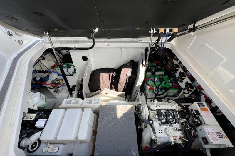 Slide: The Image of 2022 Sea Ray Sundancer 320 Outboard engine compartment with batteries and mechanical components. - 47