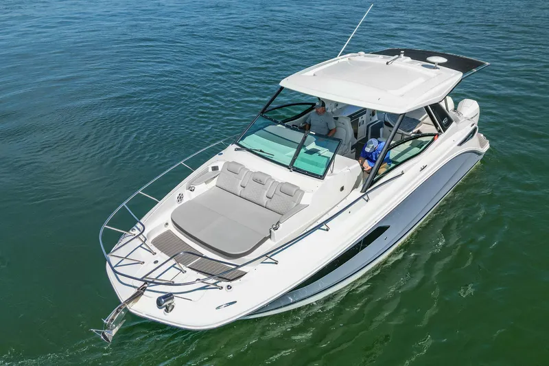 Slide: The Image of 2022 Sea Ray Sundancer 320 Outboard cruising on open water. - 6