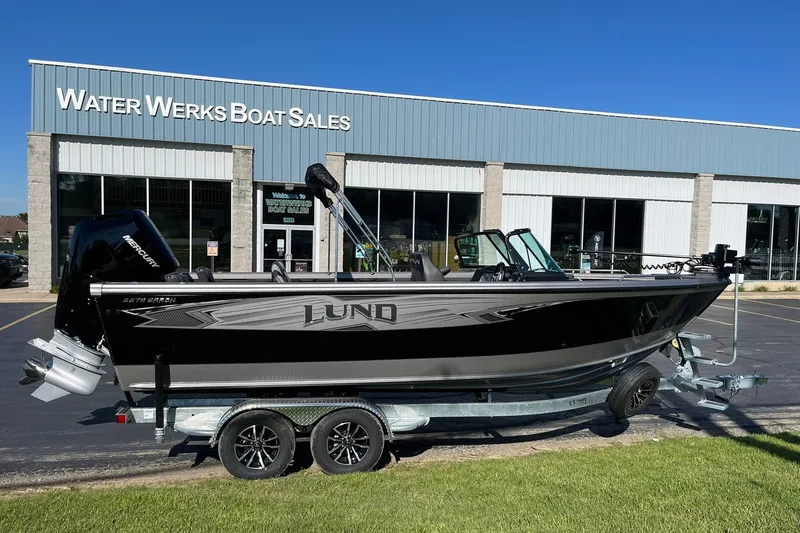 Slide: The Image of 2026 Lund 2275 Baron boat displayed at Water Werks Boat Sales dealership. - 1