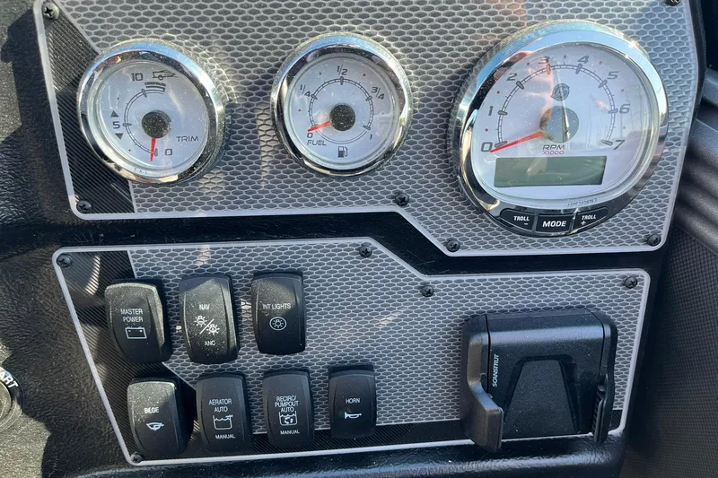 Slide: The Image of Dashboard of 2026 Lund 2275 Baron boat with gauges and control switches. - 19