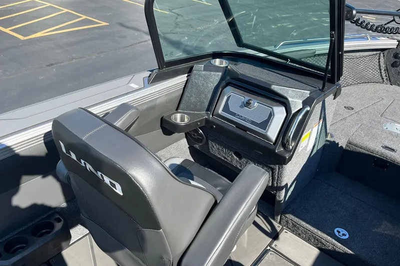 Slide: The Image of 2026 Lund 2275 Baron boat interior with steering console and seating. - 20