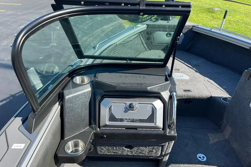Slide: The Image of 2026 Lund 2275 Baron boat interior with windshield and storage compartment. - 21