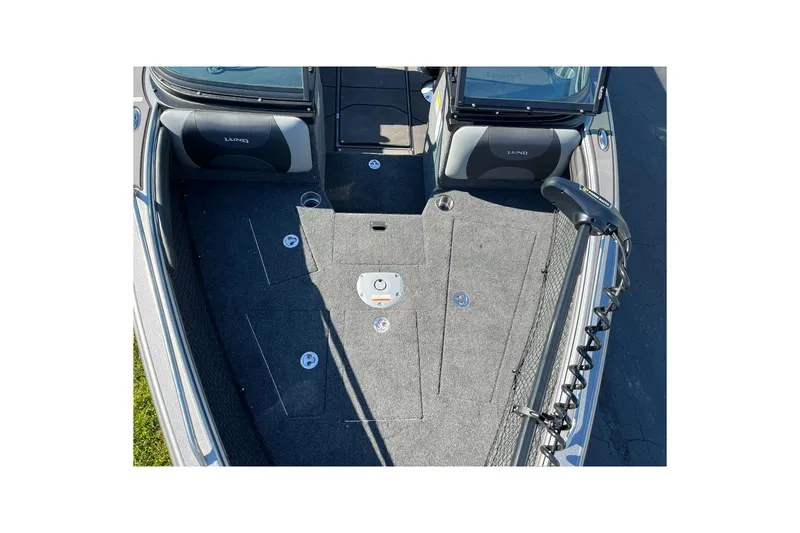 Slide: The Image of 2026 Lund 2275 Baron boat interior with carpeted deck and seating. - 25