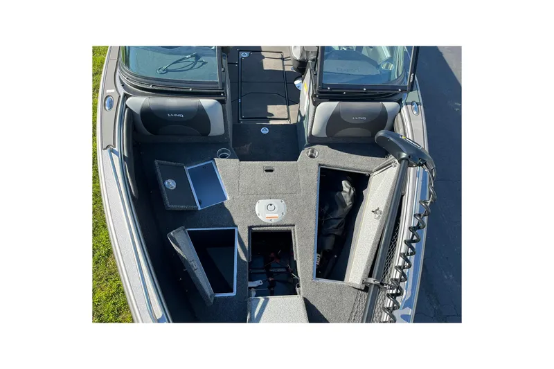 Slide: The Image of 2026 Lund 2275 Baron boat interior with open storage compartments and seating. - 27