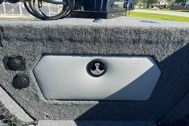 Slide: The Image of Interior of 2026 Lund 2275 Baron boat with Minn Kota equipment and carpeted finish. - 30