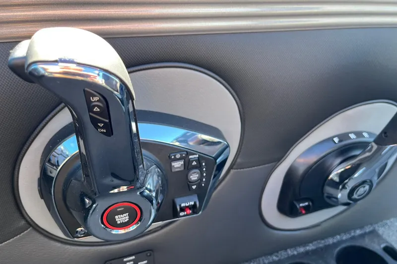 Slide: The Image of Control panel of 2026 Lund 2275 Baron boat with start-stop button and throttle lever. - 35