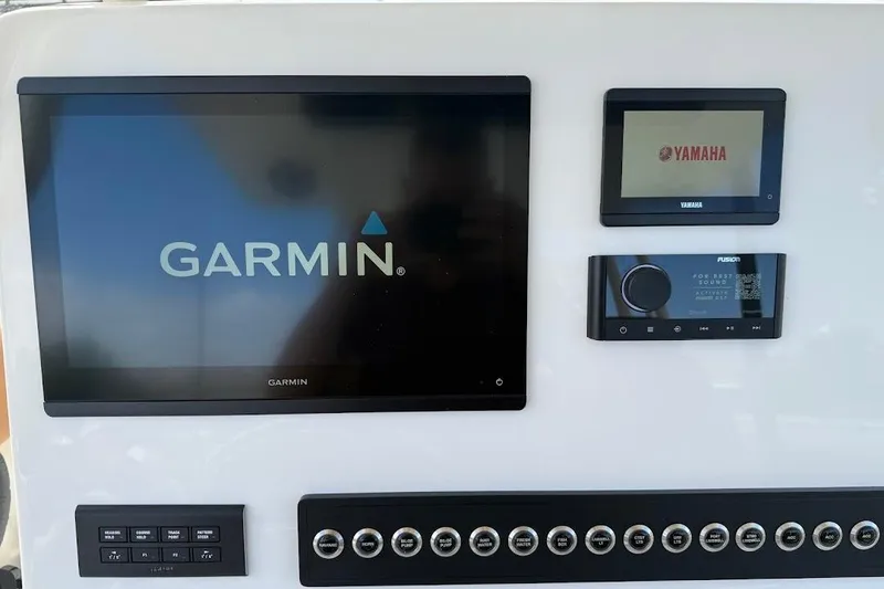 Slide: The Image of 2026 Key West 291 FS dashboard with Garmin, Yamaha, and Fusion displays. - 18