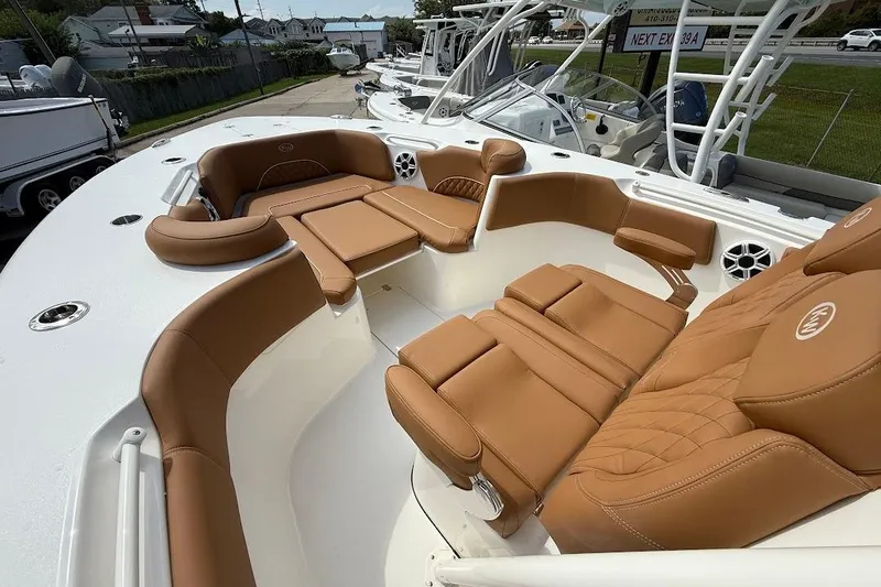 Slide: The Image of 2026 Key West 291 FS boat with luxurious tan seating and spacious deck layout. - 22