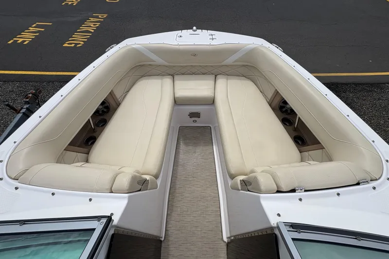 Slide: The Image of 2018 Regal 26 OBX boat bathroom with sink, toilet, and wooden flooring. - 15