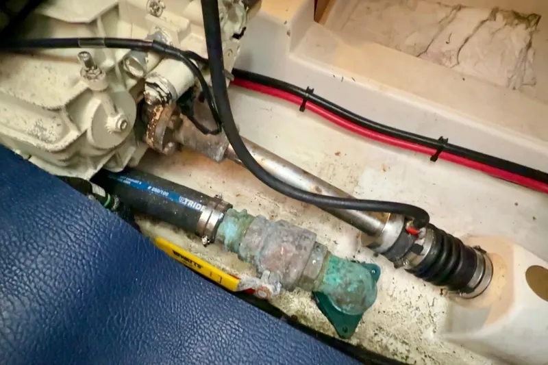 Slide: The Image of Engine compartment of a 2007 Beneteau Swift Trawler 42, showing mechanical components and wiring. - 102