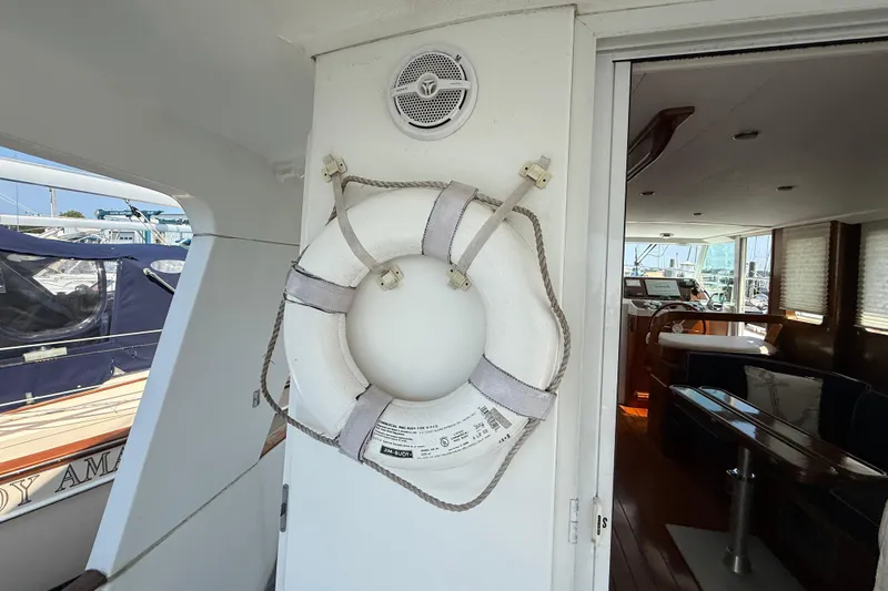 Slide: The Image of 2007 Beneteau Swift Trawler 42 interior with life preserver and nautical decor. - 17