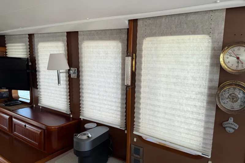 Slide: The Image of Interior of 2007 Beneteau Swift Trawler 42 with blinds, clock, and lamp. - 40