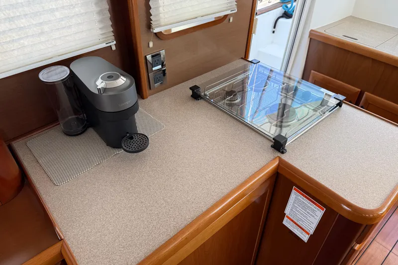 Slide: The Image of 2007 Beneteau Swift Trawler 42 kitchen with coffee maker and stove. - 45