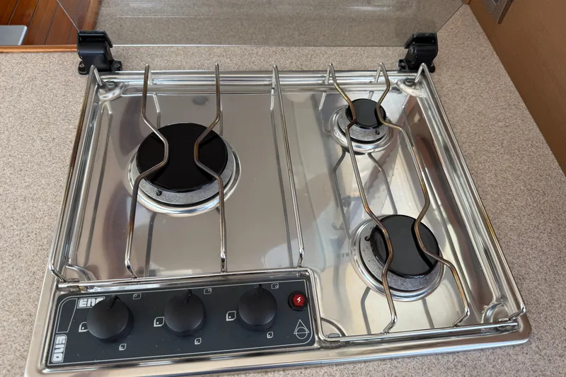 Slide: The Image of Stainless steel stove with three burners on a 2007 Beneteau Swift Trawler 42. - 55