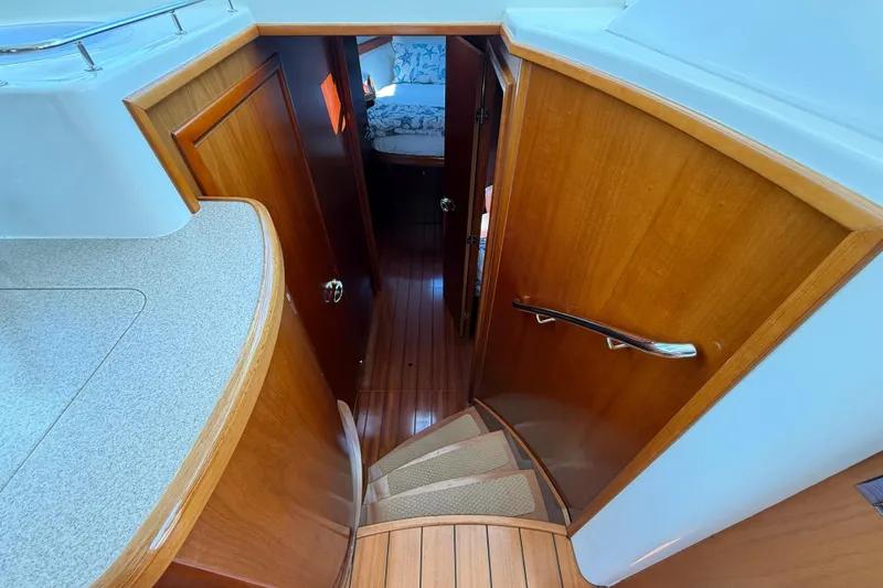 Slide: The Image of Interior view of 2007 Beneteau Swift Trawler 42, featuring wooden stairs and cabin entrance. - 57