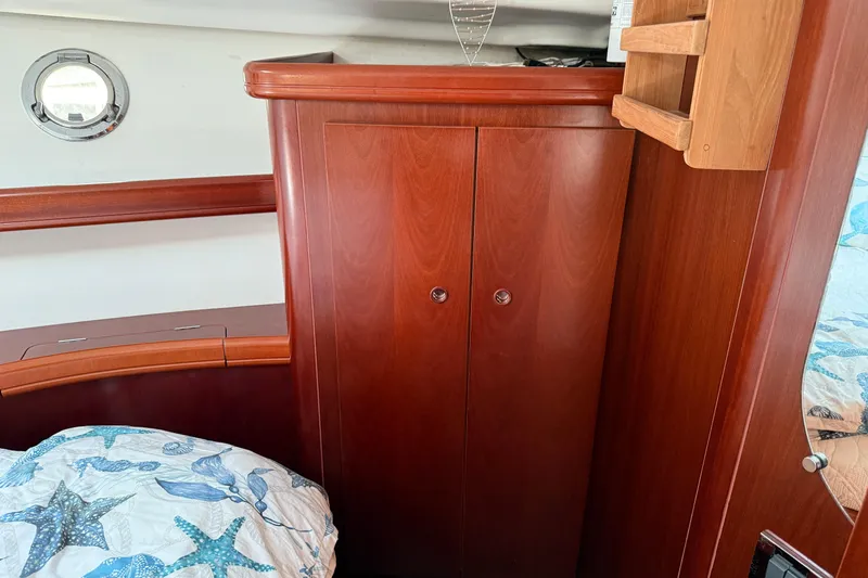 Slide: The Image of Interior of 2007 Beneteau Swift Trawler 42 with wooden cabinetry and nautical decor. - 60