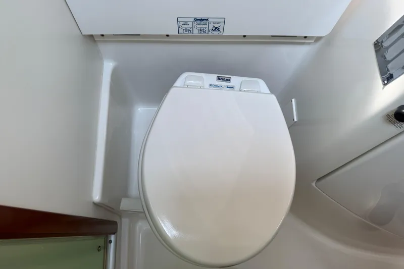 Slide: The Image of 2007 Beneteau Swift Trawler 42 bathroom with white marine toilet. - 65