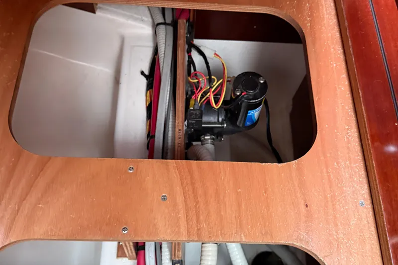 Slide: The Image of Bilge pump system inside 2007 Beneteau Swift Trawler 42, showcasing wiring and components. - 77