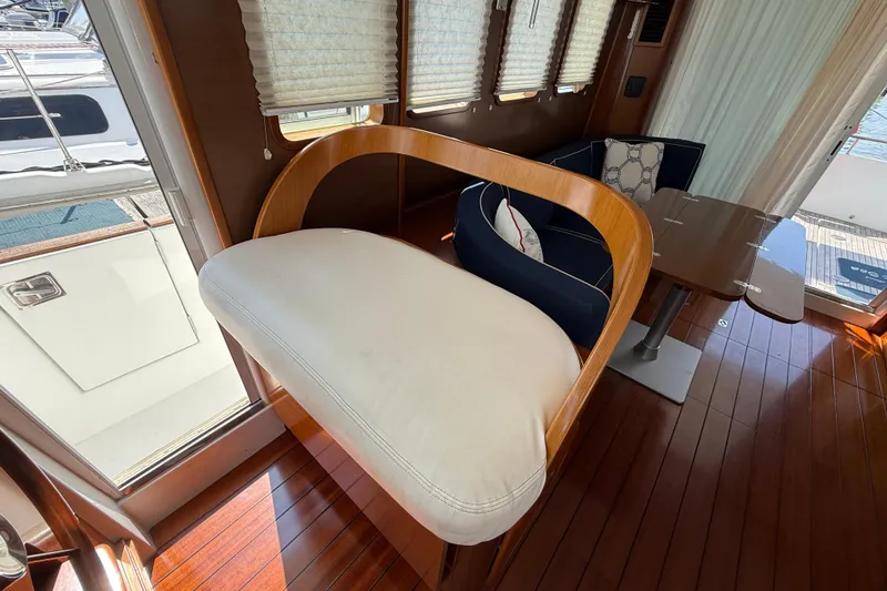 Slide: The Image of Interior of 2007 Beneteau Swift Trawler 42 with elegant seating and wooden flooring. - 79