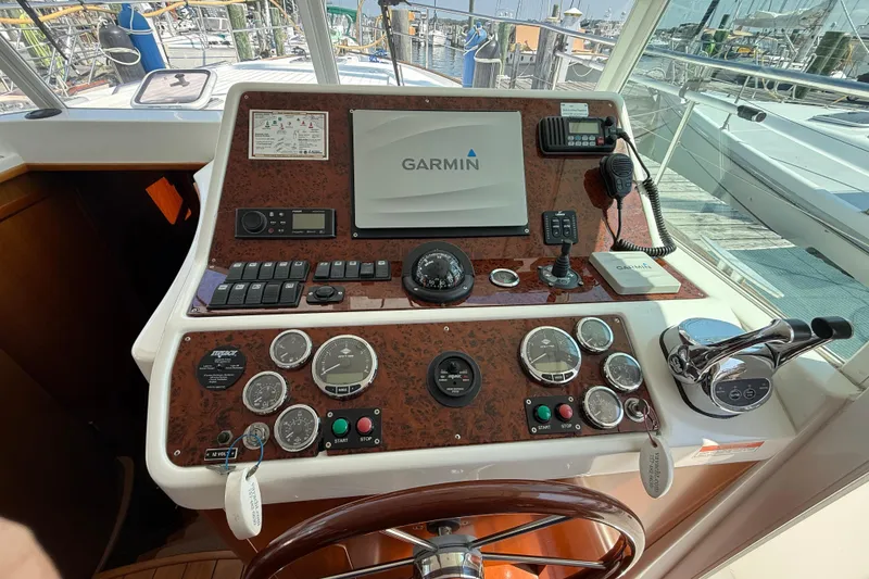 Slide: The Image of Helm of 2007 Beneteau Swift Trawler 42 with Garmin navigation system and control panel. - 80
